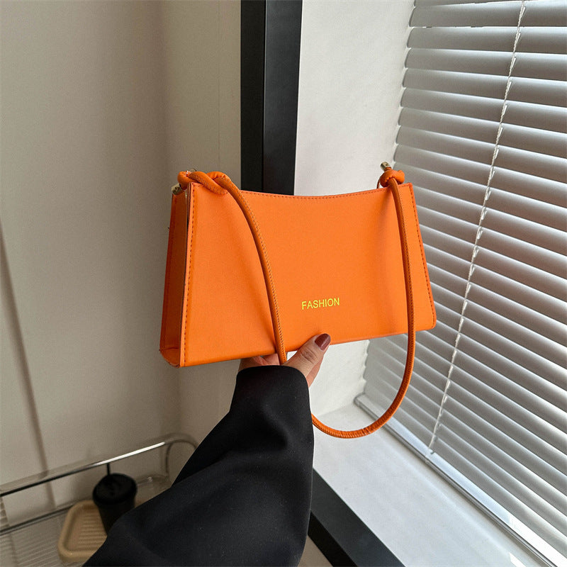 Candy-colored underarm bag