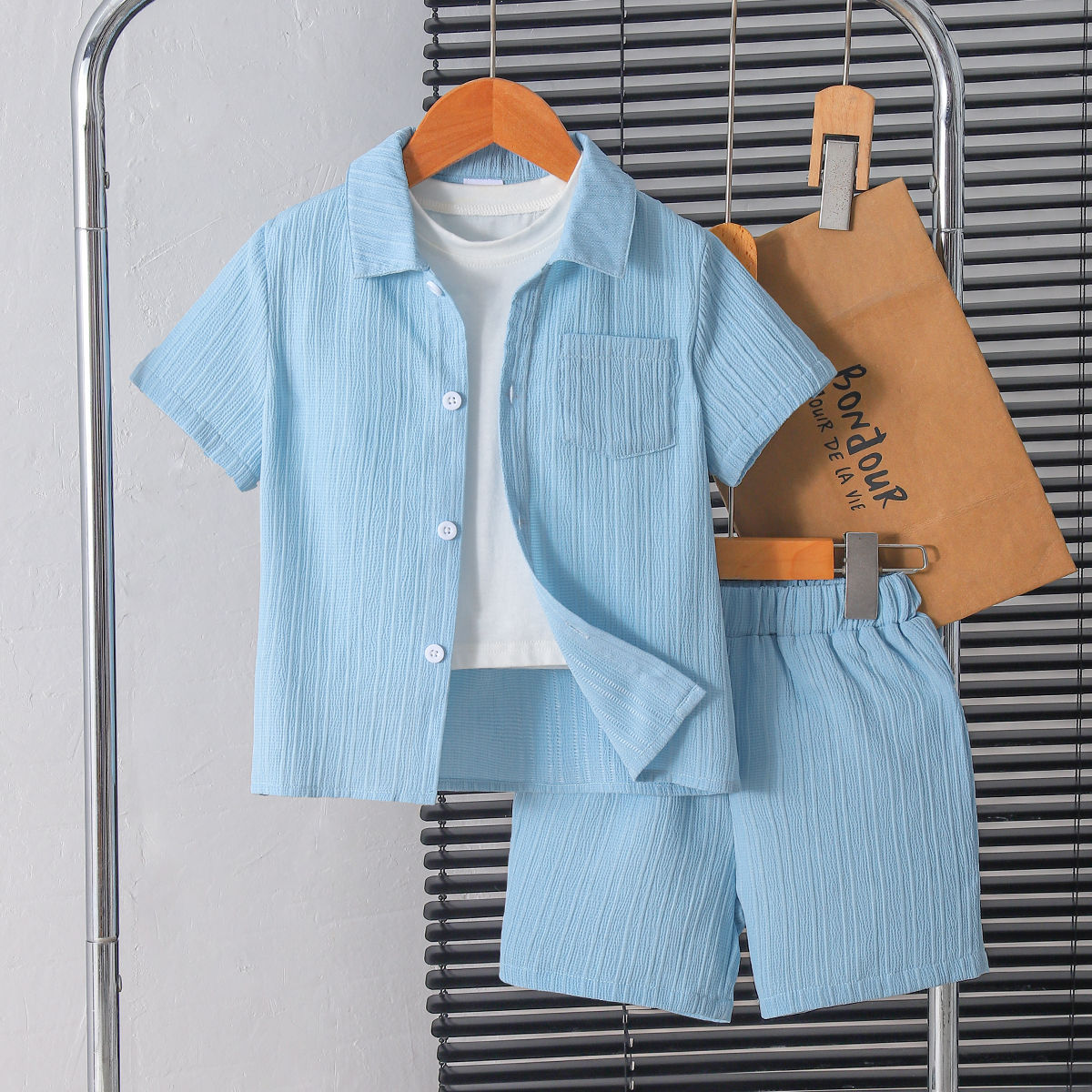 Boy's stylish gentleman's summer outfit in college style